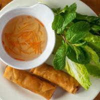 Egg Rolls Cha Gio · Deep fried egg rolls filled with carrots, taro, mung bean, cellophane noodles, and ground po...