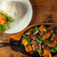 Shaking Beef · Cubed beef sautéed with broccoli, carrots, onions, bell peppers, and in a light soy sauce. S...