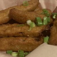 Cajun Fried Pickles · Craft beer battered pickles, fried crisp and served with ranch.