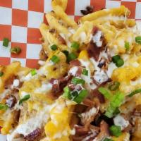 Loaded Baked Potato Fries W/Buttermilk Ranch · Waffle cut fries, bacon, cheddar jack cheese, green onion, and buttermilk ranch dressing on ...