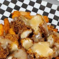 Loaded Maple Chicken Fries W/Maple Aioli · our version of chicken and waffles.  Sweet potato fries, freshly hand breaded chicken.  serv...
