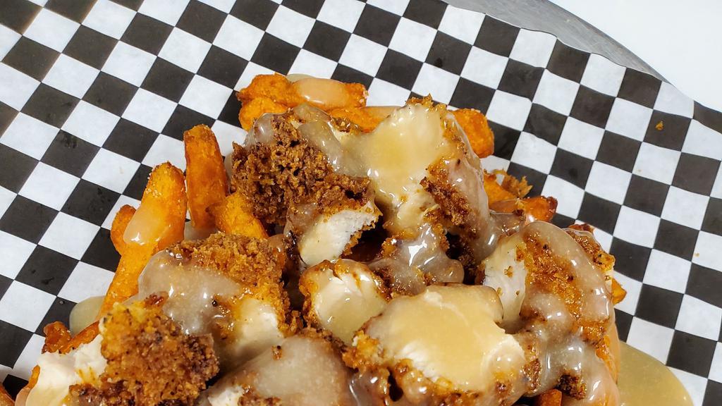 Loaded Maple Chicken Fries W/Maple Aioli · our version of chicken and waffles.  Sweet potato fries, freshly hand breaded chicken.  served with maple aioli on the side.