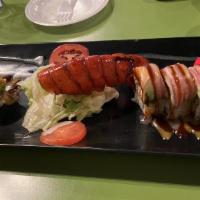 Flaming Lobster Roll · Real crab and lobster with avocado topping and fire!.