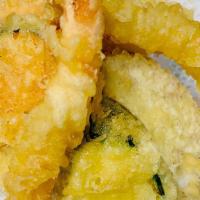Tempura Combination · Shrimp. Seasonal vegetables, lightly battered and fried.