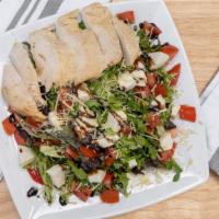 Caprese Salad · Mixed greens, grape tomatoes, fresh mozzarella, parmesan cheese, and balsamic vinaigrette on...