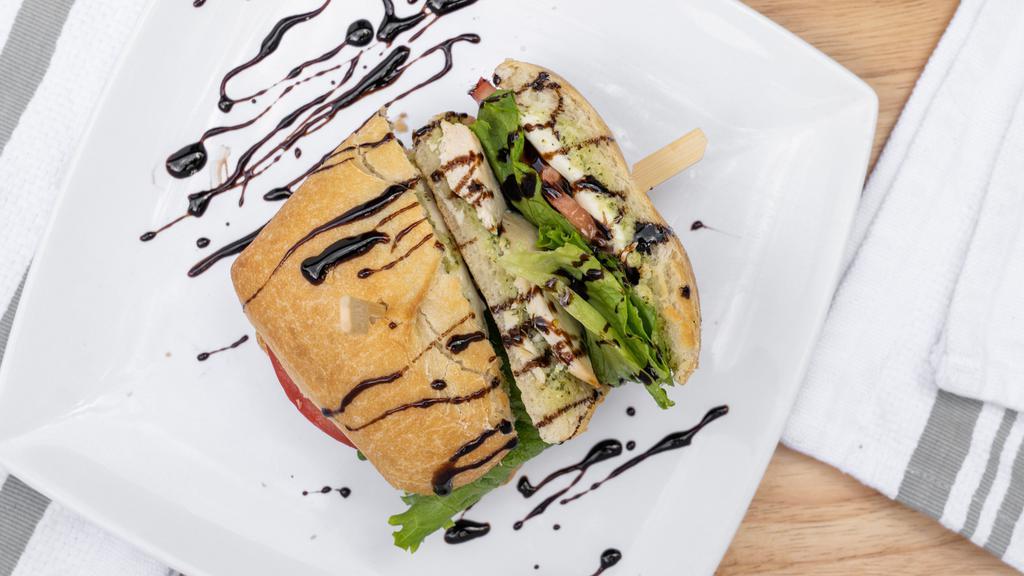 Caprese Panini Meal · Fresh basil, sliced tomatoes, fresh mozzarella, avocado, mayo, and balsamic glaze on ciabatta bread. Comes with a side salad or fresh fruit and beverage.