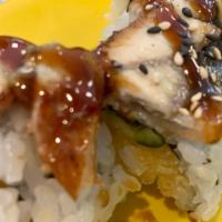 Dragon Roll · Inside; shrimp tempura and cucumbers. Top; avocado, eel.