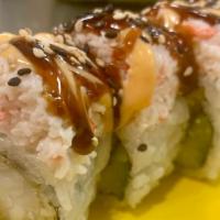 Tiger Roll · Inside; tempura shrimp, cucumber. Top; crab salad, sesame seed, spicy mayo, & eel sauce.