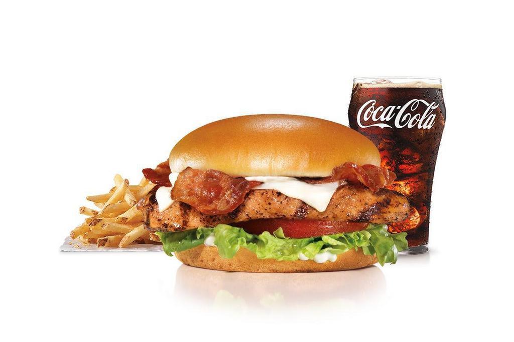 Charbroiled Chicken Club™ Sandwich Combo · Charbroiled chicken breast, two strips of Bacon, melted Swiss cheese, lettuce, tomato and mayonnaise on a potato bun. Served with fries and a beverage. .