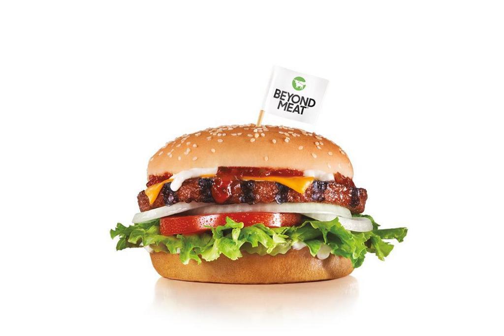 Beyond Famous Star® With Cheese · Charbroiled 100% plant-based Beyond Burger® patty on our iconic Famous Star®, featuring melted American cheese, lettuce, tomato, sliced onions, dill pickles, Special Sauce, and mayonnaise on a seeded bun.
