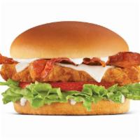 Hand-Breaded Bacon Swiss Chicken Sandwich · Premium, all-white chicken fillet, hand dipped in buttermilk, lightly breaded and fried to a...