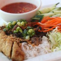 Saigon Vermicelli Noodle · Grilled pork and Vietnamese egg roll, carrots, cucumbers, lettuce and sprouts on a  soft bed...