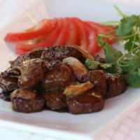 Shaking Beef Cubes · These cubes of marinated beef are fried with onion, garlic and a dash of fragrant black pepp...