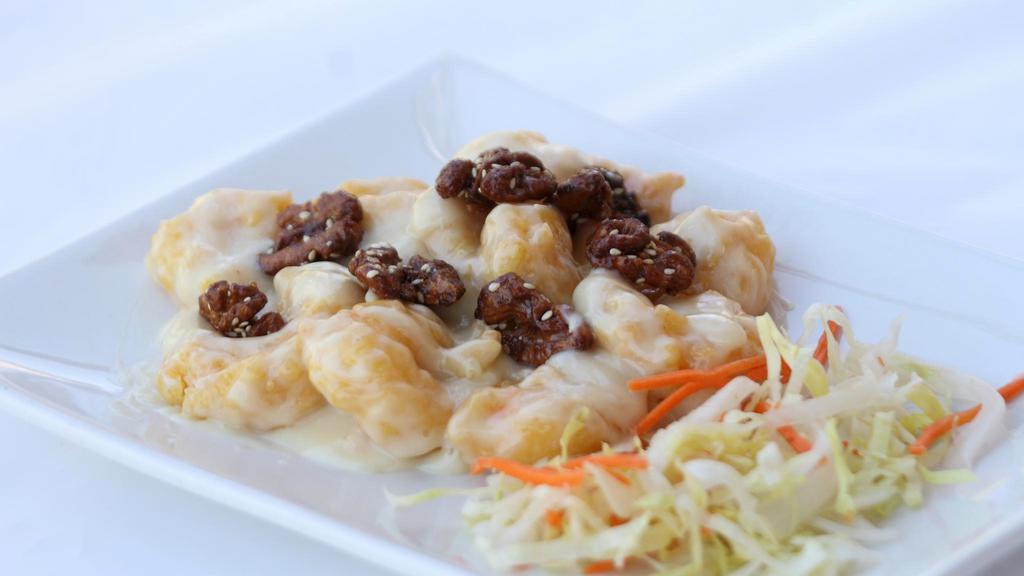 Honey Walnuts Shrimps · Exquisite rich sauce, topped with glazed caramelized walnut and a dash of sesame seeds. Served with Jasmine rice. (Gluten Free)
