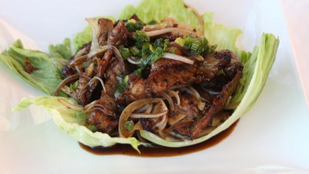 Caramel Pork · Tender pork onion, onion simmered in a savory sweet rich caramel sauce. Served with Jasmine rice.