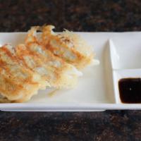 Vegan Gyoza · Crispy pan-fried potsticker filled with a vegetable medley. Served with soy sauce.