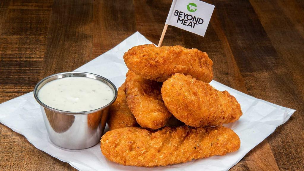 Beyond Tenders · 5 crispy fried Beyond tenders (plant base), served with a dipping sauce.