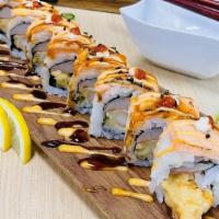 Seared Salmon Roll · Tempura shrimp, crab, cucumber, and cream cheese. Topped with seared salmon, spicy mayo, una...