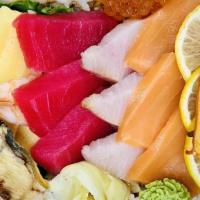 Chirashi Bowl · Assortment of sashimi and vegetables over sushi rice.