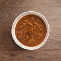 Lamb Curry · Lamb cooked with herbs and spices in a curry sauce.