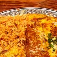 Enchiladas · Two rolled cheese and onion enchilada smothered in red chili and cheese, garnished with lett...