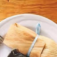 Tamales In The Husk · Filled with pork and red chile.
