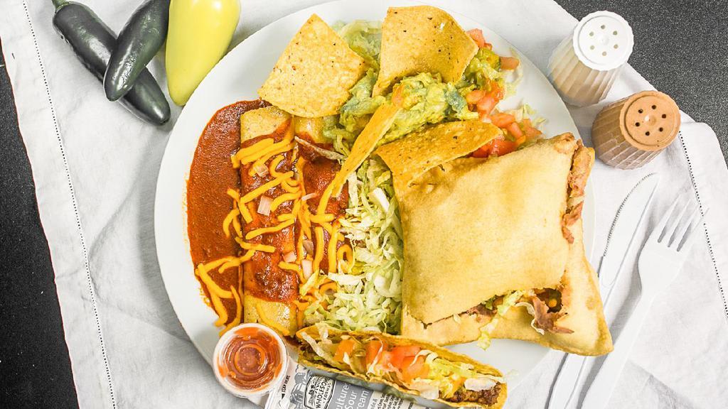 Special Plate · Two cheese and onion enchiladas, smothered in red chile and cheese. Garnished with guacamole, tostadas, lettuce and tomato. Also sample a bean stuffed sopaipilla and ground beef taco.