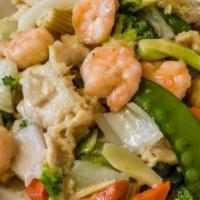 Dragon Phoenix · Shrimp and chicken seasoned with wine spices, sauteed with fresh vegetables in a mild garlic...