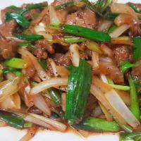 Mongolian Beef · Sliced beef marinated in a brown sauce, sauteed with scallions.