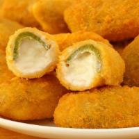 Jalapeno Poppers · Deep Fried fresh Jalapeno's stuffed with house popper stuffing and wrapped in apple wood smo...