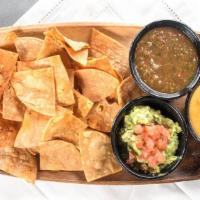 Chips & Dips Trio · A sampler of our three famous dips and house made seasoned tortilla chips.