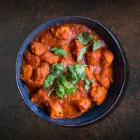 Chicken Tikka Charger · Chicken pieces roasted in a clay oven and tossed in a creamy tomato sauce. Served with side ...