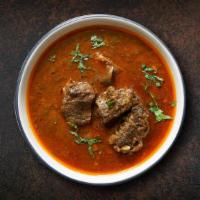 Lamb Wild Korma · Lamb pieces Cooked with tomato sauce, cream, and Indian spices. Served with side of rice.