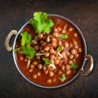 Chickpea N Curry  · Chickpeas cooked with onions, juicy tomatoes, and perfectly grounded spices. Served with sid...