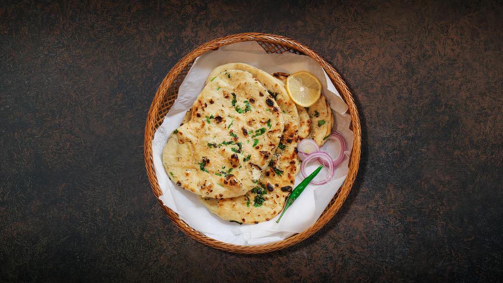 Garlic Naan Fiesta · Fresh made flatbread topped with garlic, baked in a traditional coal oven.