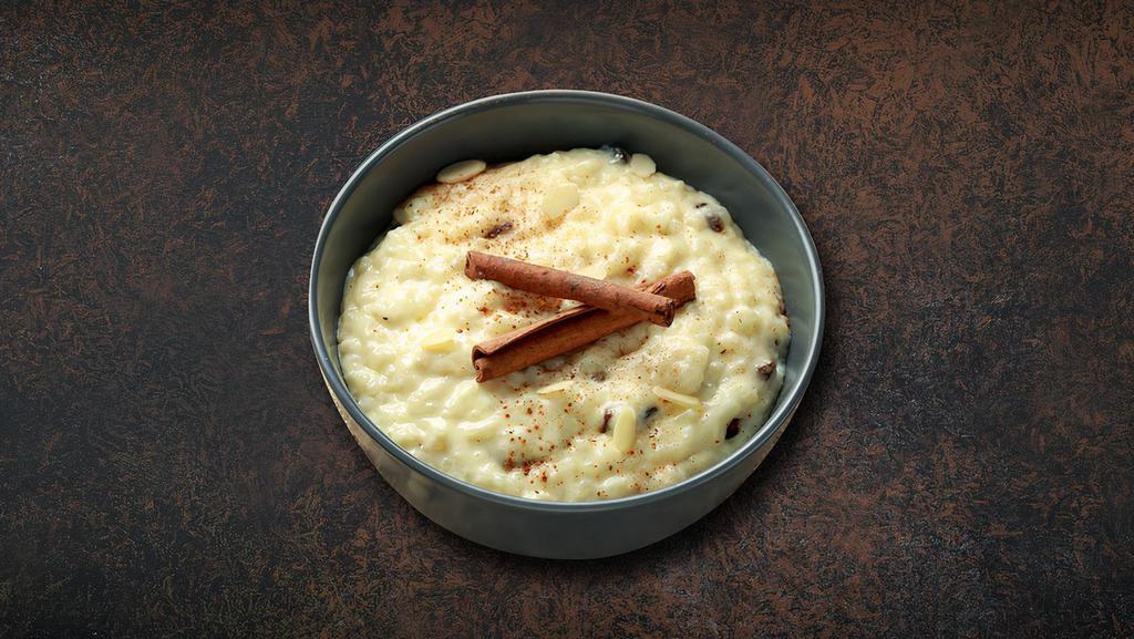 Rice Pudding · The traditional Indian rice pudding made with basmati rice, whole milk, sugar, nuts, saffron and cardamom is slow-cooked to perfection.