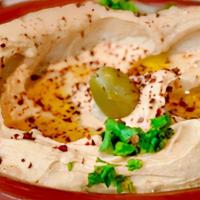 Hummus · (Vegan)(GF) Creamy chickpea dip with sesame paste, garlic, lemon & spices, topped with olive...