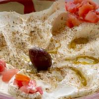 Labneh · (Vegetarian)(GF) Strained thickened yogurt topped with olive, olive oil & zaatar (includes 1...