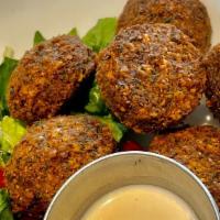 Falafel Patties · (Vegan)(GF) Veggie patties made with chickpeas, fava beans, herbs & spices, served with pick...
