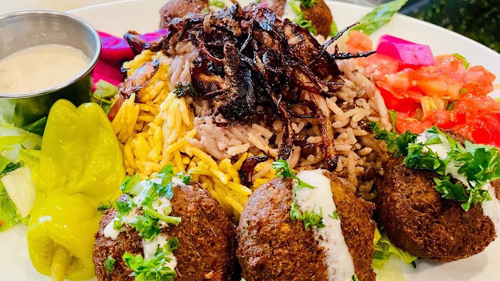 Lebanese Falafel Plate · (Vegan)(GF) Falafel, parsley, pickled turnips, tomatoes, pepperoncini, Tahini, your choice of rice & one side order (includes 1 pita)