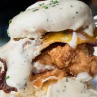 The Big Bruce · Fried chicken, fried egg, bacon, cheddar and gravy on a biscuit.