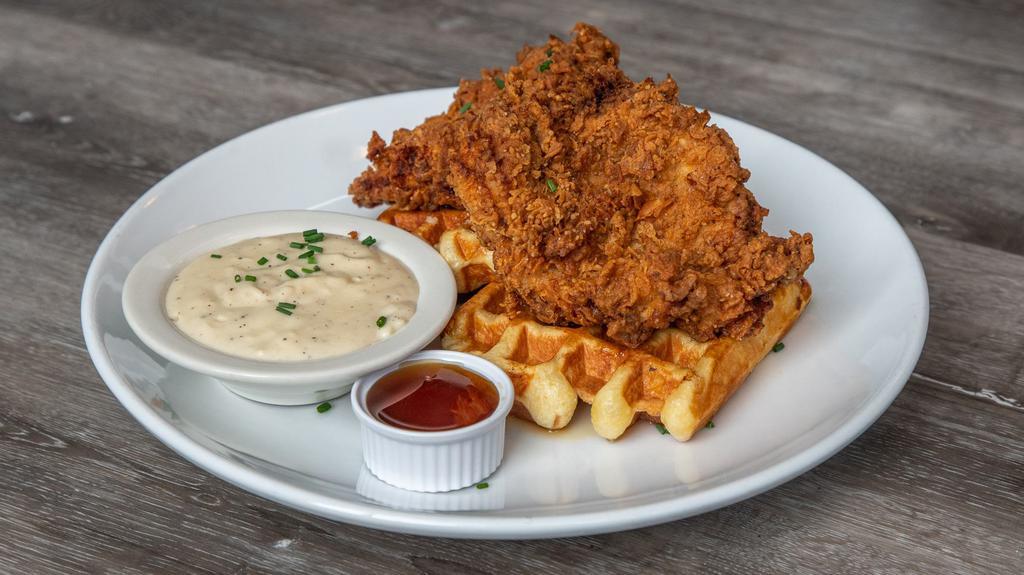 Fried Chicken & Waffles · Two Waffles topped with Buttermilk Fried Chicken. Maple Syrup and Country Gravy on the side