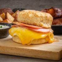 Canadian Bacon, Egg & Cheddar Biscuit Sandwich · Canadian Bacon, Egg and Tillamook Cheddar on a fresh baked Biscuit. Served with a side of gr...