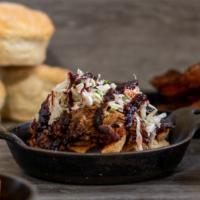 Pulled Pork On A Biscuit · With Blackberry Ancho BBQ Sauce and Coleslaw
