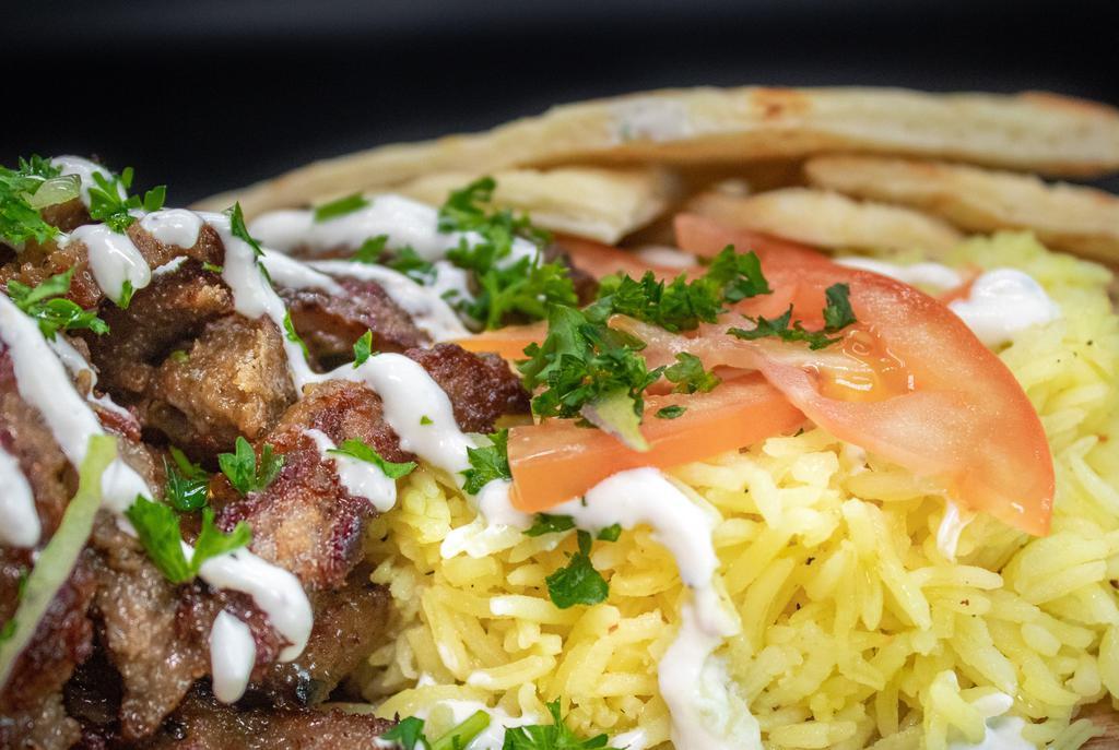 Mediterranean Plate · Choice of either lamb, chicken or falafel, served with Aybla rice, tomatoes, parsley, tzatziki and Greek pita.