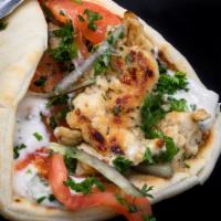 Gyro · Grilled lamb and beef or fresh chicken served in a Greek pita with tzatziki, onion, parsley,...
