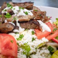 Large Greek Salad W/Lamb · Romaine lettuce, tomato, onion, red pepper, Greek feta cheese, Kalamata olives, and Dijon vi...