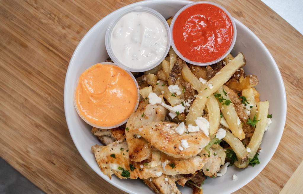 Gyro Fries Combo · Hand Cut Fries with Choice of Chicken or Lamb topped with Tzatziki, Feta, Parmesan Herbs, Garlic Sauce and comes w/ Can soda
