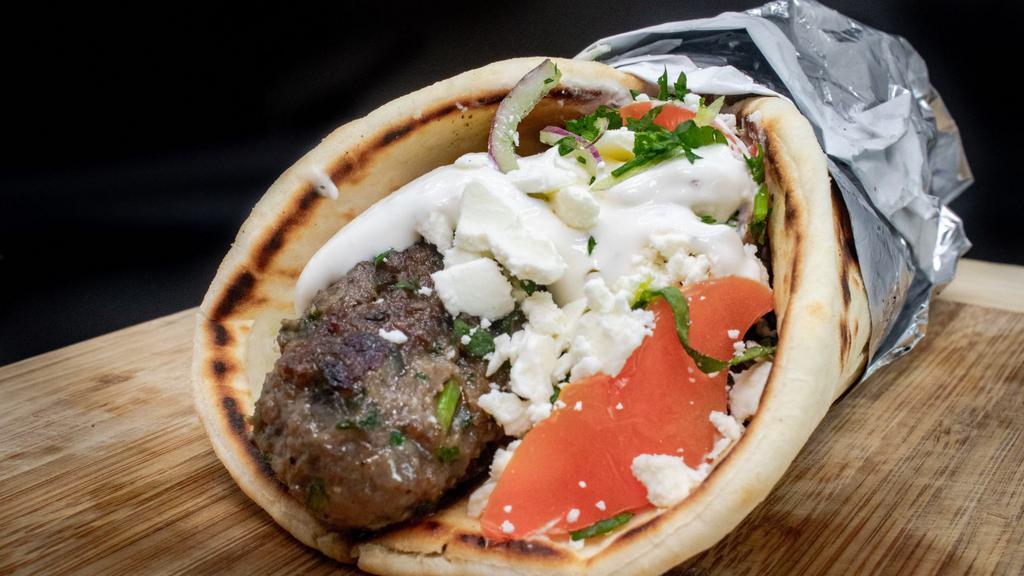 Kafta Kebab · Grilled skewers of seasoned ground beef, made daily, served in Greek pita bread with lettuce, parsley, onion, and tomato. Your choice of tzatziki or tahini sauce.