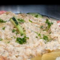 Baba Ganoush Plate · Roasted eggplant blended with fresh garlic, lemon juice, fresh herbs, tahini sauce with Gree...